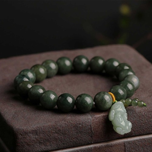 Emerald attracts abundance, while Pixiu protects and brings good fortune Emerald attracts abundance, while Pixiu protects and brings good fortune