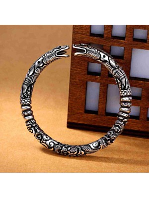 The dragon symbolizes strength and protection, while the silver promotes personal empowerment