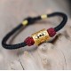 The red string provides good luck and protection against negative energy