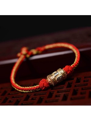 The red string is a symbol of protection, warding off negative energy, and attracting good fortune