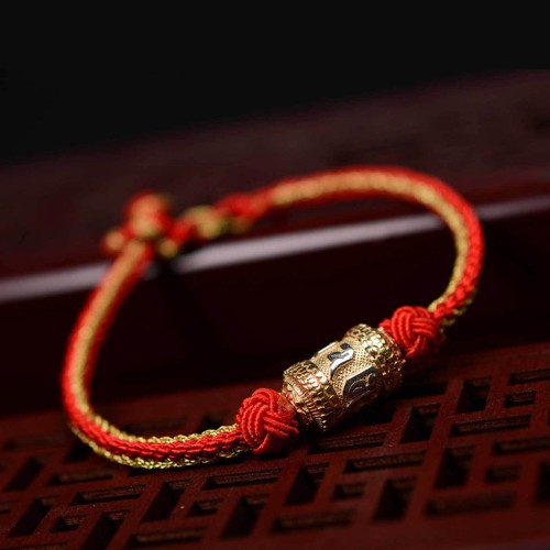 The red string is a symbol of protection, warding off negative energy, and attracting good fortune The red string is a symbol of protection, warding off negative energy, and attracting good fortune