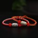 The red string is a symbol of protection, warding off negative energy, and attracting good fortune The red string is a symbol of protection, warding off negative energy, and attracting good fortune