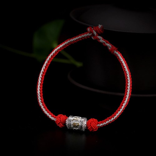 The red string is a symbol of protection, warding off negative energy, and attracting good fortune The red string is a symbol of protection, warding off negative energy, and attracting good fortune