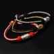 The red string is a symbol of protection, warding off negative energy, and attracting good fortune The red string is a symbol of protection, warding off negative energy, and attracting good fortune