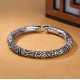 The dragon symbolizes strength and protection, while the silver promotes personal empowerment