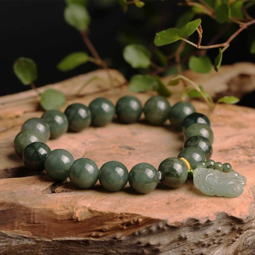 Emerald attracts abundance, while Pixiu protects and brings good fortune Emerald attracts abundance, while Pixiu protects and brings good fortune