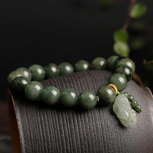 Emerald attracts abundance, while Pixiu protects and brings good fortune Emerald attracts abundance, while Pixiu protects and brings good fortune