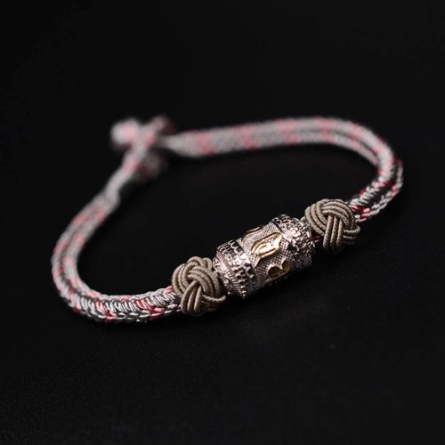 The red string is a symbol of protection, warding off negative energy, and attracting good fortune The red string is a symbol of protection, warding off negative energy, and attracting good fortune