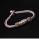The red string is a symbol of protection, warding off negative energy, and attracting good fortune