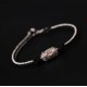 The red string is a symbol of protection, warding off negative energy, and attracting good fortune