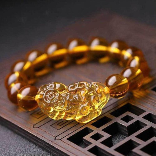 Citrine promotes wealth, and the Pixiu provides protection and good fortune Citrine promotes wealth, and the Pixiu provides protection and good fortune