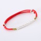 The red string brings good luck and protection, aligned with Tibetan Buddhist teachings The red string brings good luck and protection, aligned with Tibetan Buddhist teachings