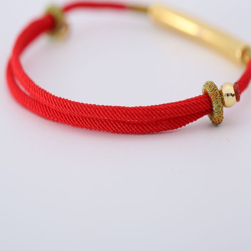The red string brings good luck and protection, aligned with Tibetan Buddhist teachings The red string brings good luck and protection, aligned with Tibetan Buddhist teachings