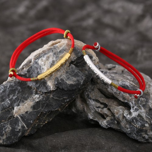 The red string brings good luck and protection, aligned with Tibetan Buddhist teachings The red string brings good luck and protection, aligned with Tibetan Buddhist teachings