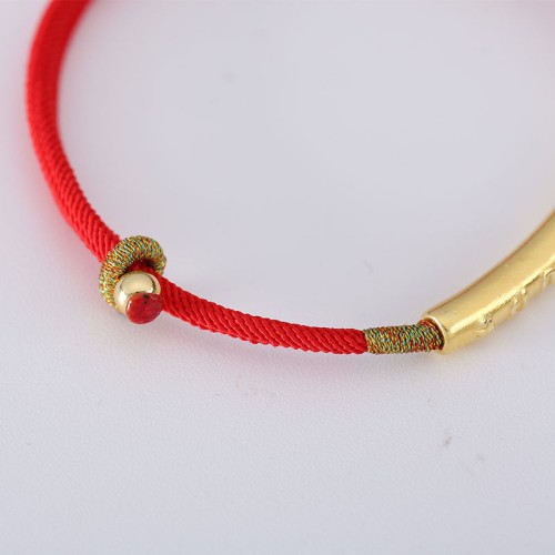 The red string brings good luck and protection, aligned with Tibetan Buddhist teachings The red string brings good luck and protection, aligned with Tibetan Buddhist teachings