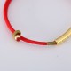 The red string brings good luck and protection, aligned with Tibetan Buddhist teachings The red string brings good luck and protection, aligned with Tibetan Buddhist teachings