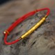 The red string brings good luck and protection, aligned with Tibetan Buddhist teachings The red string brings good luck and protection, aligned with Tibetan Buddhist teachings