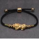 The red string and Pixiu attract wealth, good fortune, and financial prosperity