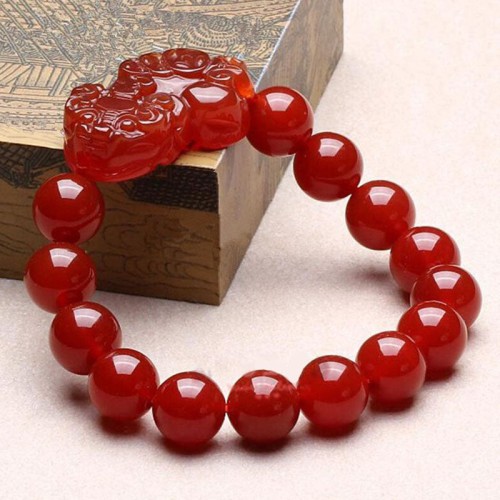 Red Agate attracts wealth and abundance, and the Pixiu provides protection and good fortune Red Agate attracts wealth and abundance, and the Pixiu provides protection and good fortune