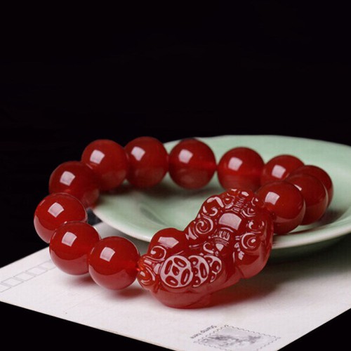 Red Agate attracts wealth and abundance, and the Pixiu provides protection and good fortune Red Agate attracts wealth and abundance, and the Pixiu provides protection and good fortune