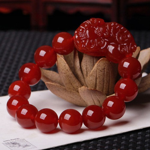 Red Agate attracts wealth and abundance, and the Pixiu provides protection and good fortune Red Agate attracts wealth and abundance, and the Pixiu provides protection and good fortune