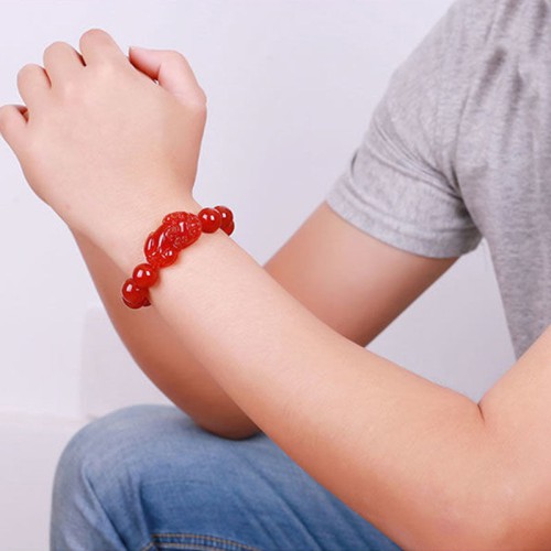 Red Agate attracts wealth and abundance, and the Pixiu provides protection and good fortune Red Agate attracts wealth and abundance, and the Pixiu provides protection and good fortune