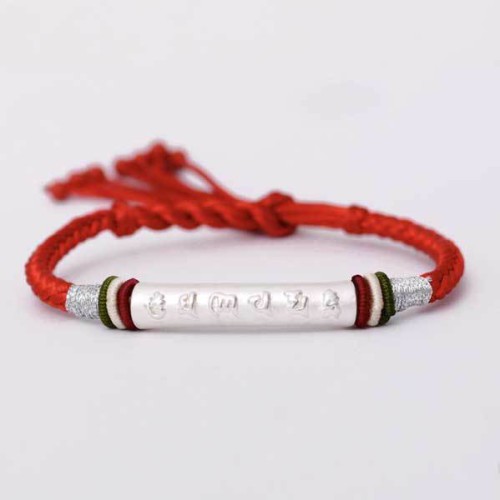 The red string protects against negative influences, while the mantra brings good luck The red string protects against negative influences, while the mantra brings good luck
