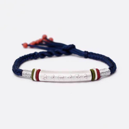 The red string protects against negative influences, while the mantra brings good luck The red string protects against negative influences, while the mantra brings good luck