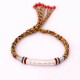 The red string protects against negative influences, while the mantra brings good luck The red string protects against negative influences, while the mantra brings good luck