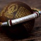 The red string protects against negative influences, while the mantra brings good luck The red string protects against negative influences, while the mantra brings good luck