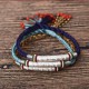 The red string protects against negative influences, while the mantra brings good luck The red string protects against negative influences, while the mantra brings good luck