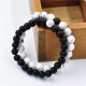Yin and Yang symbolize balance, and the beads enhance harmony and energy flow Yin and Yang symbolize balance, and the beads enhance harmony and energy flow