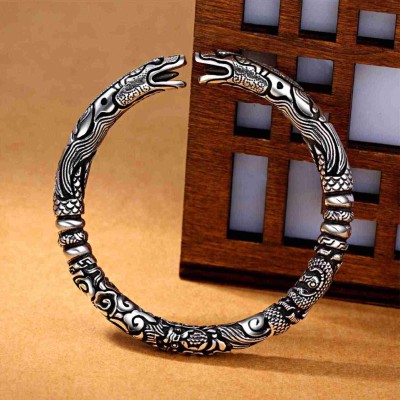 The dragon symbolizes strength and protection, while the silver promotes personal empowerment