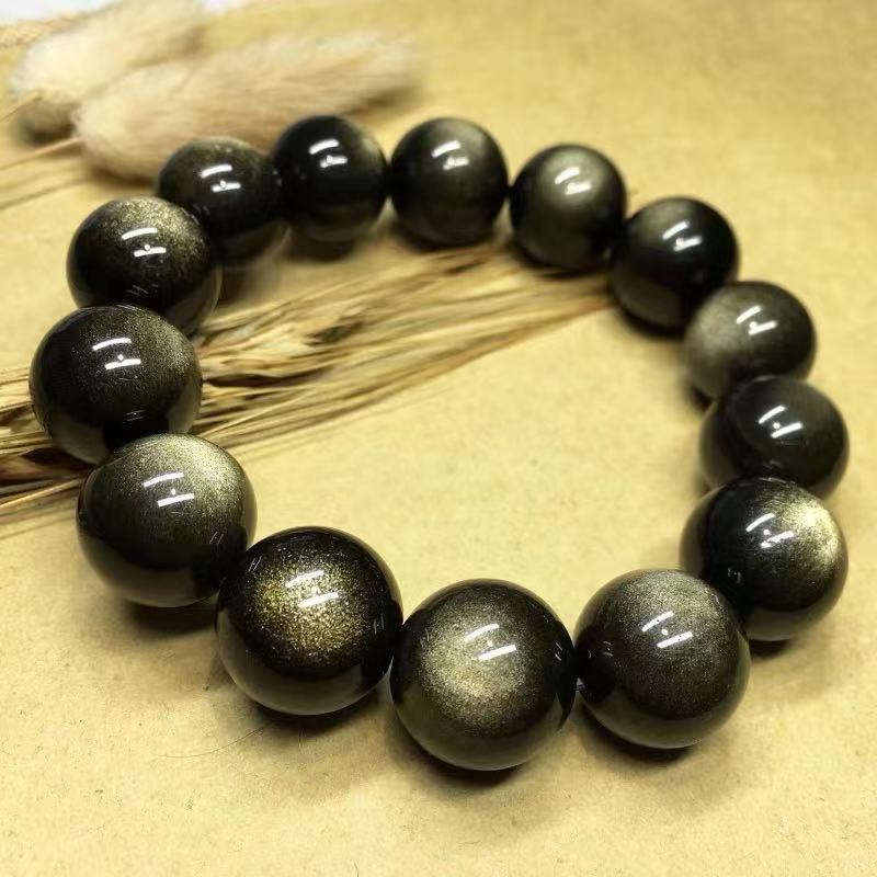Our Black Gold Obsidian Couple Bracelets Hold Two Eyes