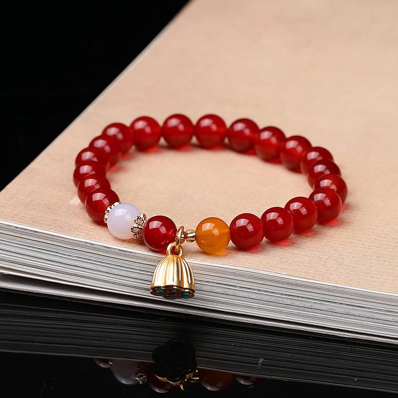 This Natural Red Agate Lotus Pod Bracelet Glows