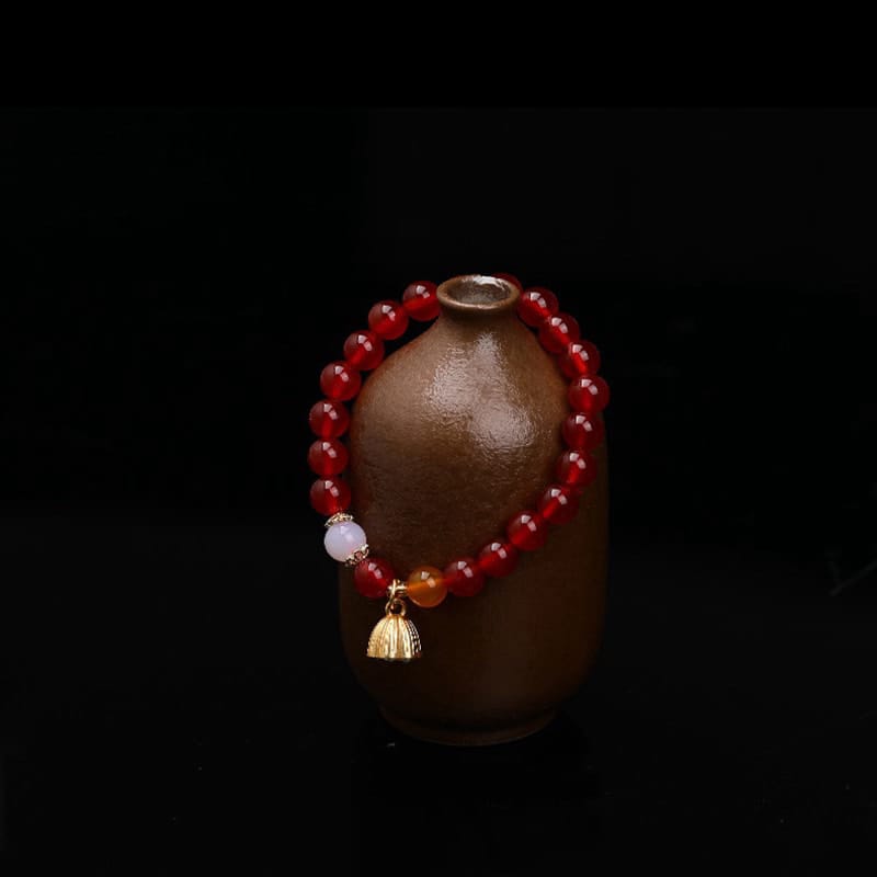 This Natural Red Agate Lotus Pod Bracelet Glows