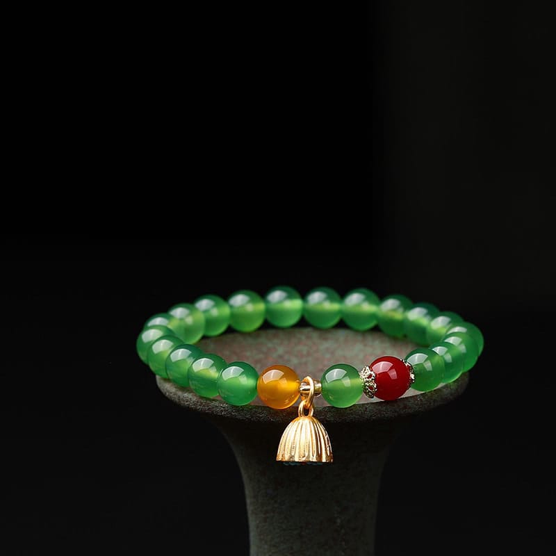 This Natural Red Agate Lotus Pod Bracelet Glows
