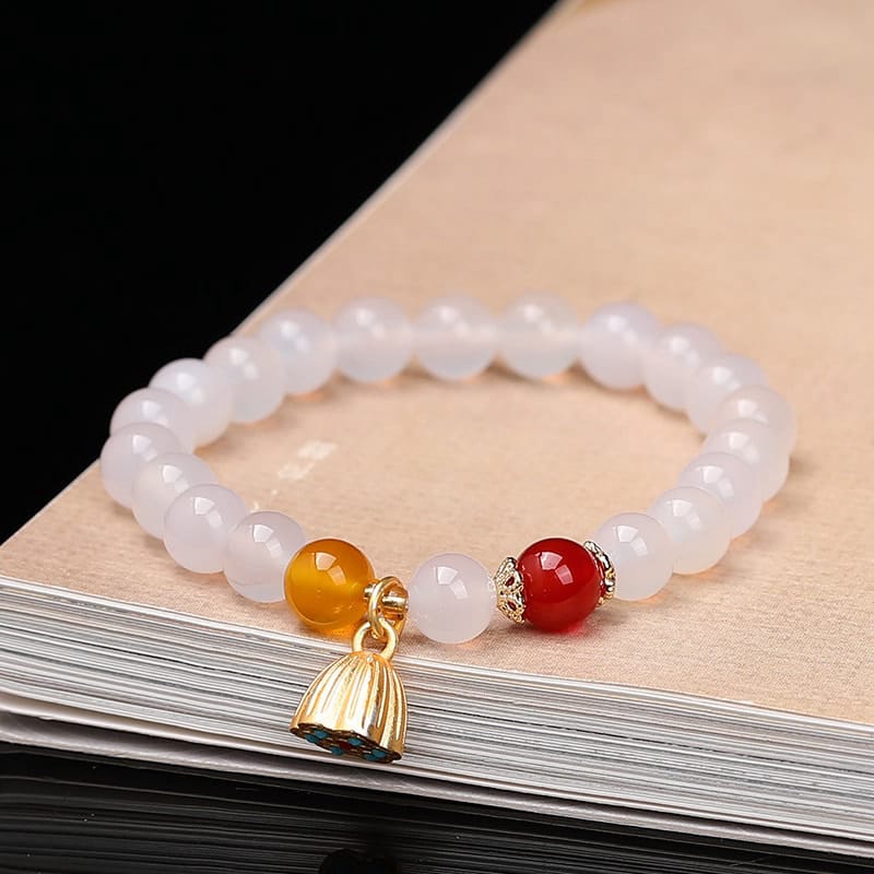 This Natural Red Agate Lotus Pod Bracelet Glows